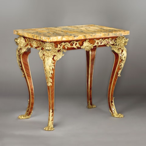 An Italian Régence gilt-bronze mounted tulip-wood Centre-Table
