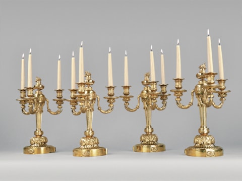 A Set of four Louis XVI three-branch ormolu Girandoles