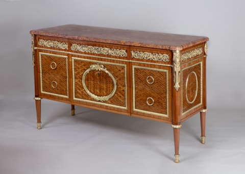 A Royal French parquetry and ormolu-mounted Commode