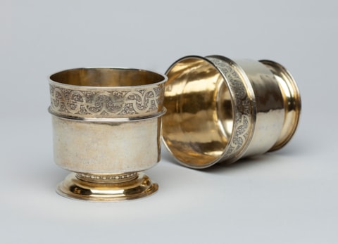 A Pair of German silver-gilt Stacking Beakers with mauresque decor